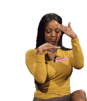 a woman wearing a yellow shirt with a name tag that says motortiti