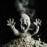 a black and white photo of a screaming baby