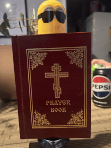 a prayer book with a cross on the cover