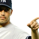 a man wearing a ny yankees hat is pointing his finger