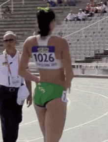 a female runner with the number 1036 on her back