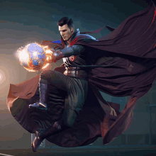 a man in a cape holding a soccer ball with the letter g on it