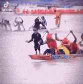 a group of people are rowing boats on a lake .