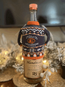 a bottle of tito 's handmade vodka is sitting on a table