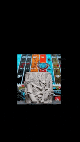 a statue with skulls on it is sitting on a table in front of a board game .