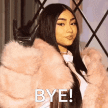 a woman is wearing a pink fur coat and gloves and says bye .