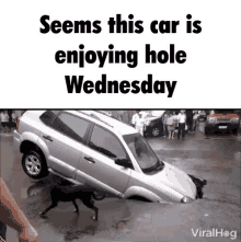 a car is stuck in a hole and says seems this car is enjoying hole wednesday viralhog