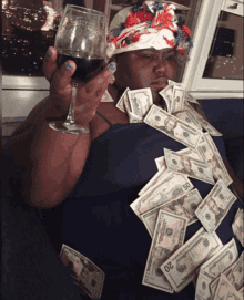 a woman is surrounded by twenty dollar bills