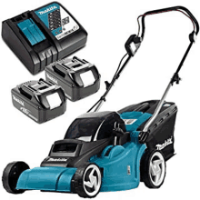 a makita lawn mower is sitting next to a makita charger and two batteries .