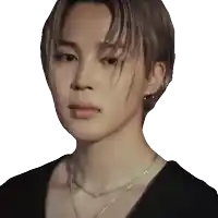 a close up of a person wearing a black shirt and a necklace
