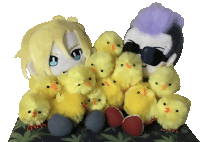 a couple of stuffed animals sitting next to each other with a bunch of yellow chicks