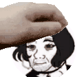 a hand is putting a hat on the head of a man .