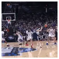 a basketball game is being played in front of a banner that says miracle bounces