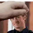 a hand is holding a man 's head in a pixelated image .