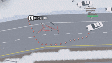 an aerial view of a snowy road with a pick up button