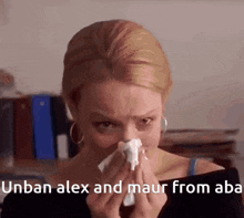 a woman blowing her nose with the words unban alex and maur from aba written below her