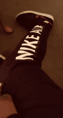 a person wearing a pair of nike air leggings