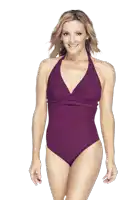 a woman in a purple swimsuit is smiling