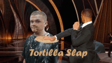 a man with a tortilla on his face and the words tortilla slap