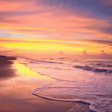 a sunset over the ocean with waves crashing on the shore