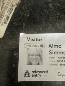 an advanced entry visitor card with a picture of a woman on it