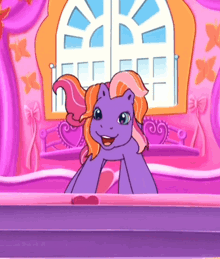 a purple pony is sitting on a bed with a window behind it