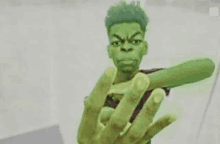 a cartoon of a man dressed as the incredible hulk is giving the middle finger .