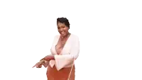 a woman in a white top and red skirt is pointing to the side