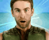 a man with a surprised look on his face wears a green vest
