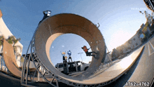 a skateboarder is doing a trick on a ramp with the number 4762 written on the bottom