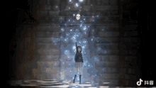 a girl in a school uniform is standing in a dark room with a mask in the background