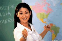 a woman stands in front of a blackboard that says europe asia america