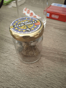 a jar of lemon haze is sitting on a wooden table