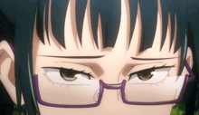 a close up of a person wearing glasses with a purple rim