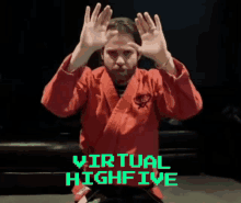 a man in a red karate uniform holds his hands up in front of a virtual high five sign