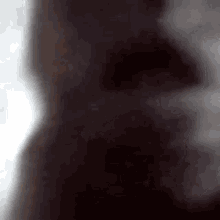 a close up of a person 's face with smoke coming out of it 's mouth