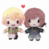 a boy and a girl are standing next to each other with a red heart between them