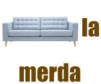 a blue couch with the word merda written on it