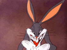 bugs bunny from looney tunes is smiling with his mouth open