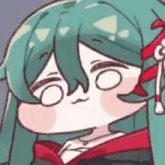 a close up of a cartoon character with green hair and a red bow on her head .