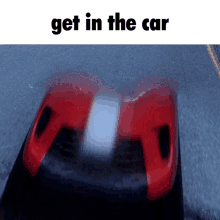 a picture of a red car with the words get in the car