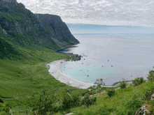 a view of the ocean from a hillside