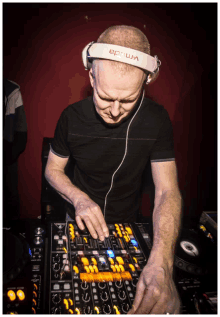 a man wearing a pair of eprum headphones playing music