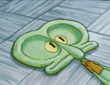 a squidward from spongebob squarepants is laying on the floor .