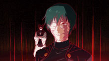 a man with glasses stands next to another man in a dark room