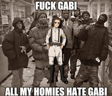 a group of people standing next to each other with the caption " fuck gabi all my homies hate gabi " .