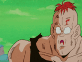 a cartoon character with red hair and a t on his forehead is making a funny face