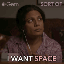 a woman wearing earbuds says i want space