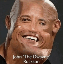 a close up of a man 's face with the words `` john the dwayne rockson '' written on it .