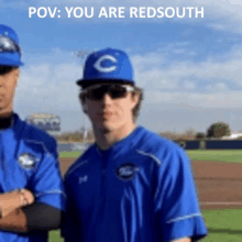 a baseball player in a blue uniform with a c on his hat